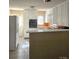 Galley kitchen with white cabinets and orange countertops at 1426 Reid Harkey Rd, Matthews, NC 28105