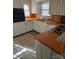 Bright kitchen with white cabinets and orange countertops at 1426 Reid Harkey Rd, Matthews, NC 28105