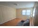 Living room with hardwood floors and two windows at 1426 Reid Harkey Rd, Matthews, NC 28105