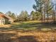 Large backyard with mature trees and grassy area at 1744 White Fawn Ln, Rock Hill, SC 29730