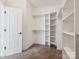 Spacious walk-in closet with built-in shelving and hanging rods at 1744 White Fawn Ln, Rock Hill, SC 29730