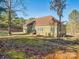 Side view of house showcasing landscaping and a grassy backyard at 1744 White Fawn Ln, Rock Hill, SC 29730