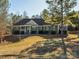 One-story house with green siding, brown roof, and attached two-car garage at 1744 White Fawn Ln, Rock Hill, SC 29730