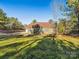 Back of house showing a door to the backyard and a grassy area at 1744 White Fawn Ln, Rock Hill, SC 29730