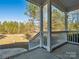 Front porch with white railings, steps, and a view of the wooded area at 1744 White Fawn Ln, Rock Hill, SC 29730