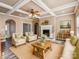 Bright living room features a fireplace, coffered ceiling and comfy seating at 1744 White Fawn Ln, Rock Hill, SC 29730