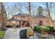 Brick home with large driveway and landscaping at 19216 Wildcat Trl, Davidson, NC 28036