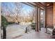 Porch with view of the front yard and trees at 19216 Wildcat Trl, Davidson, NC 28036