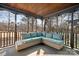 Relaxing screened porch with wicker furniture and wooded views at 19216 Wildcat Trl, Davidson, NC 28036