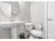 Clean bathroom with pedestal sink and toilet at 298 Bouchard Dr, Waxhaw, NC 28173