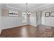 Dining room with hardwood floors, chandelier, and wainscoting at 298 Bouchard Dr, Waxhaw, NC 28173