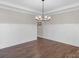 Dining room with hardwood floors, chandelier, and wainscoting at 298 Bouchard Dr, Waxhaw, NC 28173