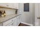 White shaker cabinets, granite countertop, and chalkboard wall in butlers pantry at 3001 Cedric Ct, Fort Mill, SC 29715