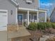 Inviting front porch with rocking chairs and landscaping at 3001 Cedric Ct, Fort Mill, SC 29715