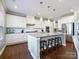 Modern kitchen with white cabinets, granite countertops and island at 3001 Cedric Ct, Fort Mill, SC 29715