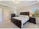 Main bedroom with king-size bed, dresser and access to bathroom at 3001 Cedric Ct, Fort Mill, SC 29715