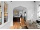 Bright dining area with a wooden table and view into the kitchen at 336 Anthony Cir, Charlotte, NC 28211