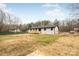 Home with grassy backyard and deck at 375 Woodwedge Cir, Salisbury, NC 28144