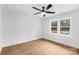 Bright and airy bedroom with neutral walls and wood floors at 375 Woodwedge Cir, Salisbury, NC 28144