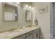 Double vanity bathroom with granite countertops and updated fixtures at 517 Trillium Way, Belmont, NC 28012