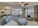 Living area featuring L-shaped sectional and ottoman at 517 Trillium Way, Belmont, NC 28012