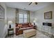 Home office featuring a brown leather couch and ottoman at 517 Trillium Way, Belmont, NC 28012