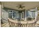 Relaxing screened porch with seating area and ceiling fan at 517 Trillium Way, Belmont, NC 28012