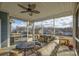 Screened porch with sectional sofa and view of backyard at 517 Trillium Way, Belmont, NC 28012