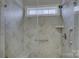 Walk-in shower with tiled walls and built-in seat at 517 Trillium Way, Belmont, NC 28012