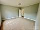 Simple bedroom with carpet and door at 568 Mahaffey Dr, Salisbury, NC 28146