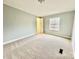 Bedroom with window, carpet, and door at 568 Mahaffey Dr, Salisbury, NC 28146