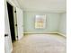 Spacious bedroom with carpeted floor and large window at 568 Mahaffey Dr, Salisbury, NC 28146