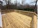 Spacious wooden deck overlooks the wooded backyard at 568 Mahaffey Dr, Salisbury, NC 28146