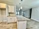 Modern kitchen with white cabinets, granite countertops, and island at 568 Mahaffey Dr, Salisbury, NC 28146