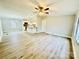 Open concept living area with vinyl flooring and modern ceiling fan at 568 Mahaffey Dr, Salisbury, NC 28146