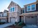 Two-story townhome with stone accents and two-car garage at 810 Ayrshire Ave, Fort Mill, SC 29708