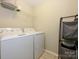 Convenient laundry room with washer, dryer, and shelving at 810 Ayrshire Ave, Fort Mill, SC 29708