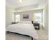 Bright main bedroom featuring a king-size bed and two nightstands at 810 Ayrshire Ave, Fort Mill, SC 29708