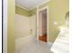 Bathroom with tub and shower, and access to hallway at 9182 Bonnie Briar Cir, Charlotte, NC 28277