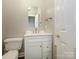 Updated bathroom with white vanity and marble top at 9182 Bonnie Briar Cir, Charlotte, NC 28277