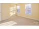 Bright bedroom with two windows and neutral walls at 9182 Bonnie Briar Cir, Charlotte, NC 28277