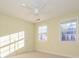 Well-lit bedroom with two windows and neutral walls at 9182 Bonnie Briar Cir, Charlotte, NC 28277