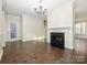 Dining room with hardwood floors, fireplace and staircase at 9182 Bonnie Briar Cir, Charlotte, NC 28277