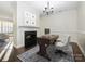 Elegant dining room with hardwood floors, fireplace, and chandelier at 9182 Bonnie Briar Cir, Charlotte, NC 28277