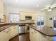 Modern kitchen with granite counters and stainless steel appliances at 9182 Bonnie Briar Cir, Charlotte, NC 28277