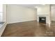 Bright living room with hardwood floors and a fireplace at 9182 Bonnie Briar Cir, Charlotte, NC 28277