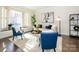 Bright living room with a bay window, stylish furniture, and natural light at 9182 Bonnie Briar Cir, Charlotte, NC 28277