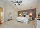 Spacious main bedroom featuring neutral tones, a ceiling fan, and accent wall for visual appeal at 9182 Bonnie Briar Cir, Charlotte, NC 28277