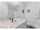 Clean bathroom with white vanity, toilet and shower/tub combo at 9907 Reindeer Way Ln, Charlotte, NC 28216