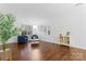 Bright living room with hardwood floors and ample natural light at 9907 Reindeer Way Ln, Charlotte, NC 28216